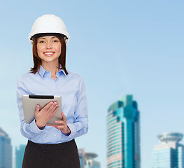 Image showing young smiling businesswoman in white helmet