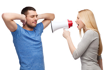 Image showing girlfriend screaming though megaphone at boyfriend