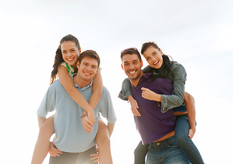 Image showing group of smiling people having fun on the beach