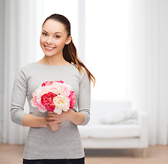 Image showing young woman with bouquet of flowers