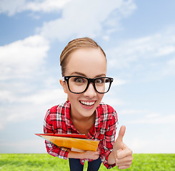 Image showing student in glasses with folders showing thumbs up