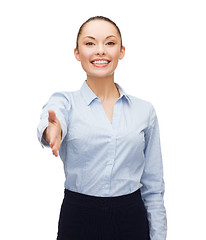 Image showing businesswoman with opened hand ready for handshake