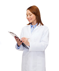 Image showing smiling female doctor with clipboard