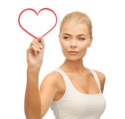 Image showing woman in white shirt writing in the air