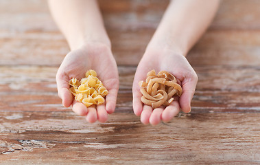 Image showing female hands with different pasta variations