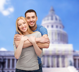 Image showing smiling couple hugging