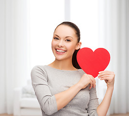 Image showing smiling asian woman with red heart