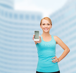 Image showing sporty woman with smartphone
