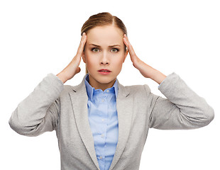 Image showing stressed businesswoman having headache