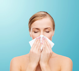 Image showing beautiful woman with paper tissue