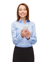 Image showing young smiling businesswoman with smartphone