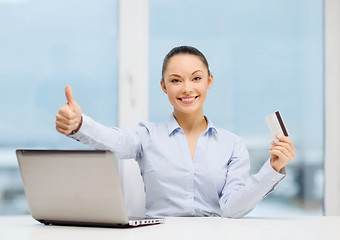 Image showing businesswoman with laptop in office