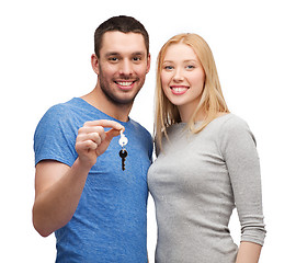 Image showing smiling couple holding keys