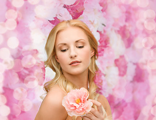 Image showing lovely woman with peony flower