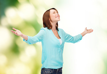 Image showing smiling woman waving hands