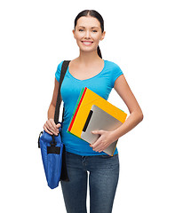 Image showing smiling student with bag, folders and tablet pc