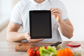 Image showing close up of male hands holding tablet pc