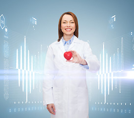 Image showing smiling female doctor with heart