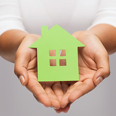 Image showing woman hands holding green house