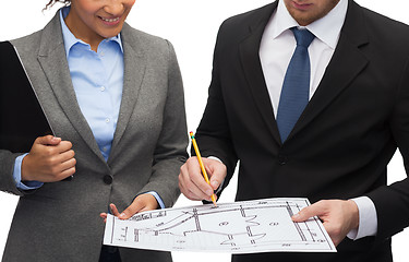 Image showing businesspeople with clipboard, blueprint, helmet