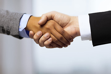 Image showing businessman and businesswoman shaking hands