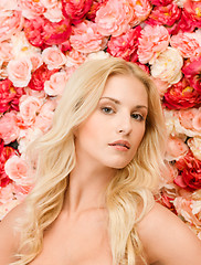 Image showing beautiful woman and background full of roses