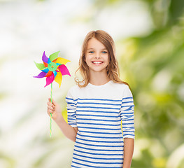 Image showing smiling child with colorful windmill toy