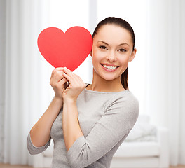 Image showing smiling asian woman with red heart