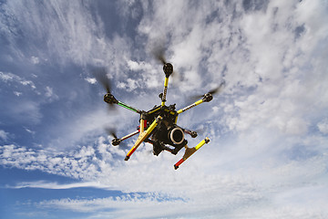 Image showing Octocopter drone flying with camera