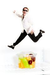 Image showing man jumping over fruit cup