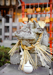 Image showing Stone cow statue in Japanese temple 