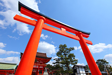 Image showing Red torii in front of temple