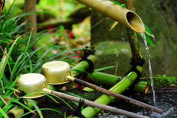 Image showing Bamboo water fountain with ladle in Japanese temple