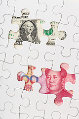 Image showing US and Chinese currency as part of puzzle 