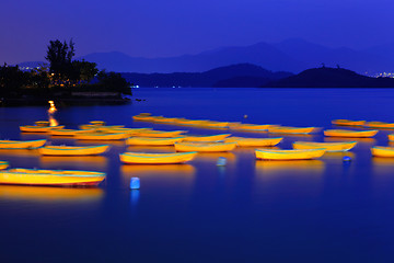 Image showing Seascape and small boat at night