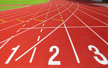 Image showing Red running track with number