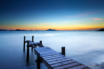 Image showing Wooden jetty with sunset