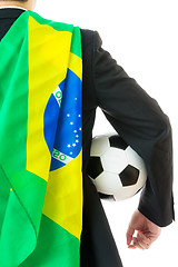 Image showing Back view of businessman with soccer ball and Brazil flag