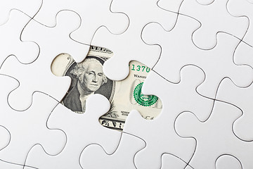 Image showing White puzzle and US banknote