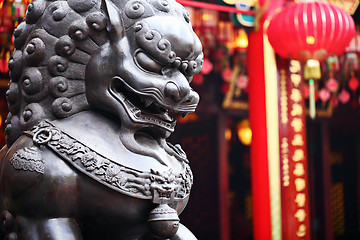 Image showing Lion statue in front of chinese temple