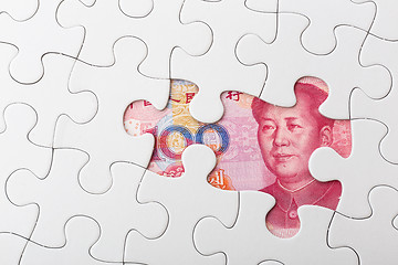 Image showing Chinese yuan and puzzle piece