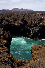 Image showing people     lanzarote los hervideros sky cloud beach  and summer 