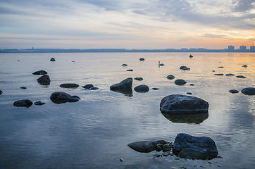 Image showing Beautiful sunrise on the sea. Views of Tallinn.