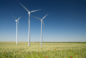 Image showing Wind generator turbine on spring landscape