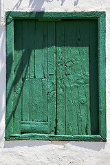 Image showing spain green wood   window in a white wall arrecife  