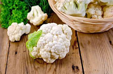 Image showing Cauliflower with a basket on the board