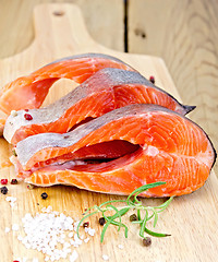 Image showing Trout on board with rosemary and salt