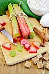 Image showing Rhubarb with sugar and knife on board
