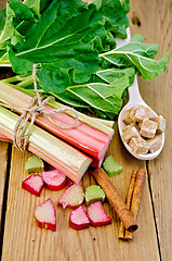 Image showing Rhubarb on board with sugar and cinnamon