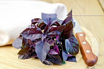 Image showing Basil purple with a knife on board